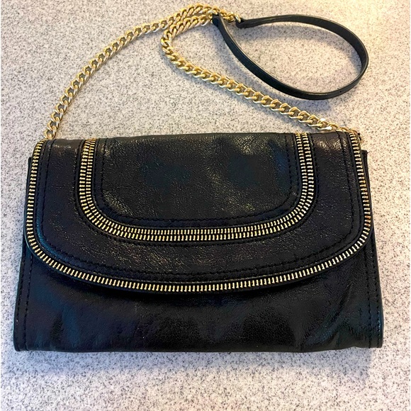 Michael Kors Handbags - Michael Kors black leather purse. Zipper details and gold tone hardware.